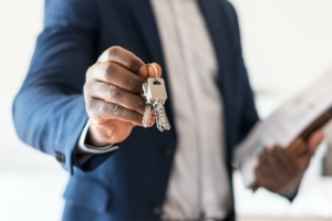 Real estate agent handing the house key